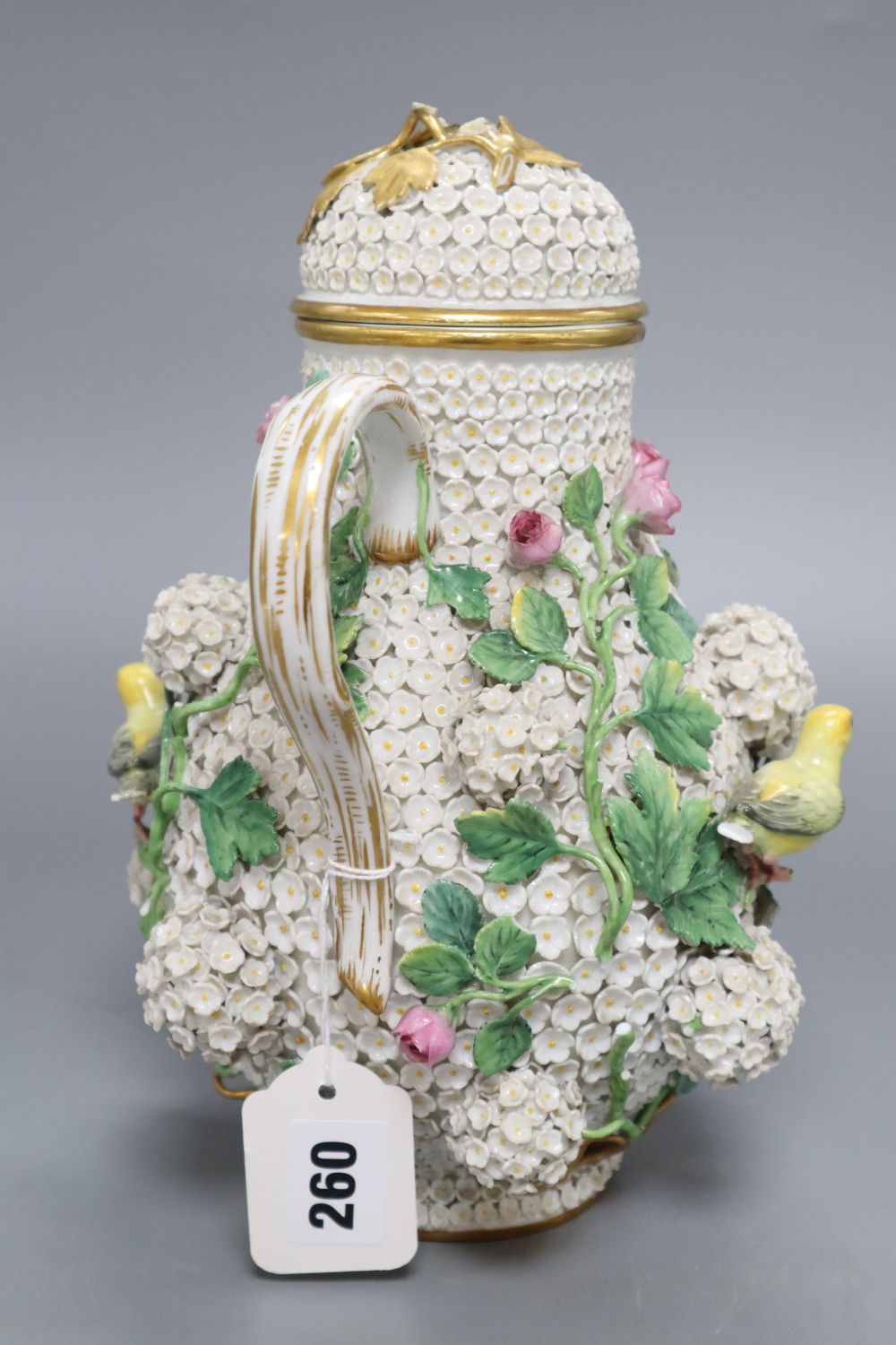 A Meissen floral encrusted hot water jug and cover, height 26cm